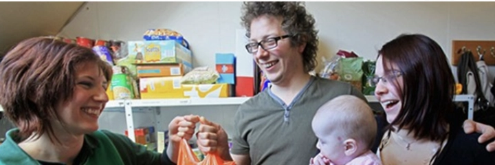 A family receives a donation from the Foodbank