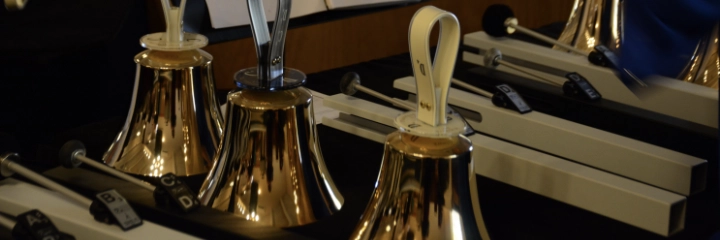 Three golden handbells