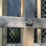 St James's Church with a wooden cross with a St James scallop symbol affixed