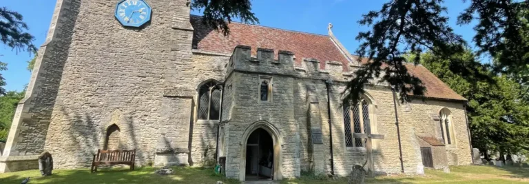 St James's Church on a sunny day through the cedar trees
